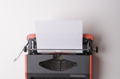 writer working on typewriter in office